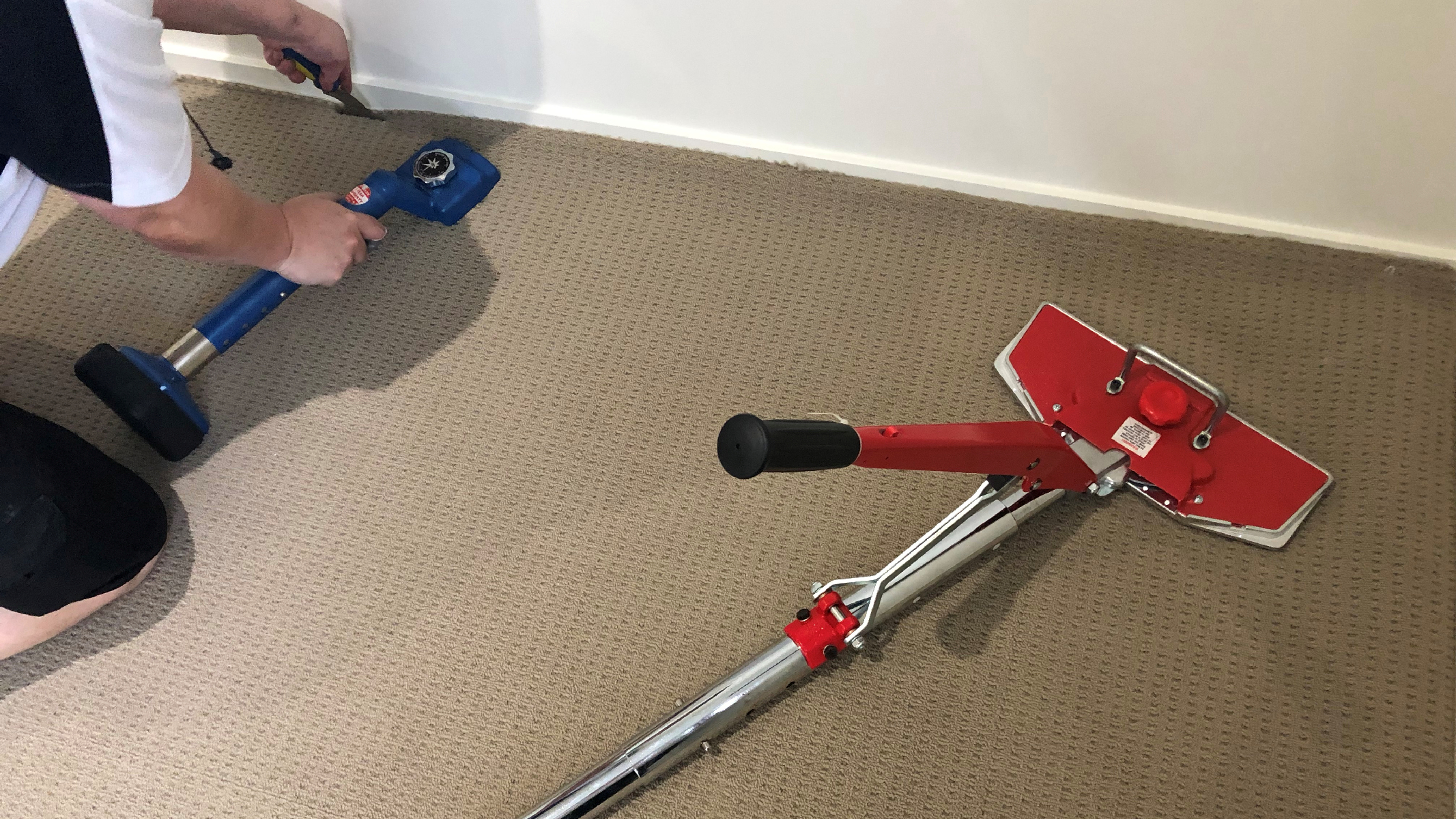 Carpet Repair - Grime Fighters Cleaning re-laying a carpet