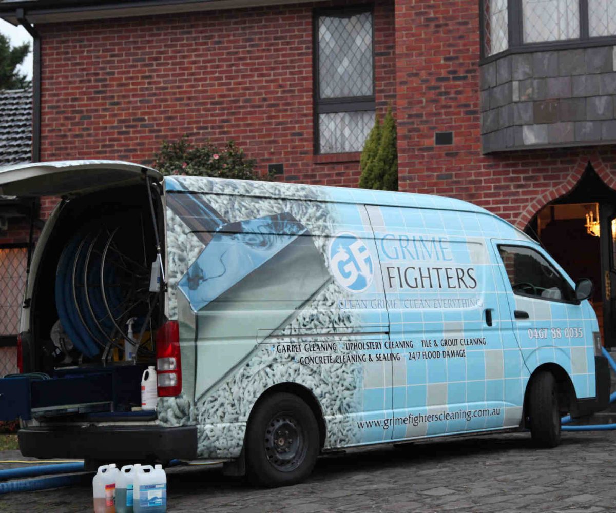 Grime Fighters Cleaning - Van with latest equipment outside luxury home